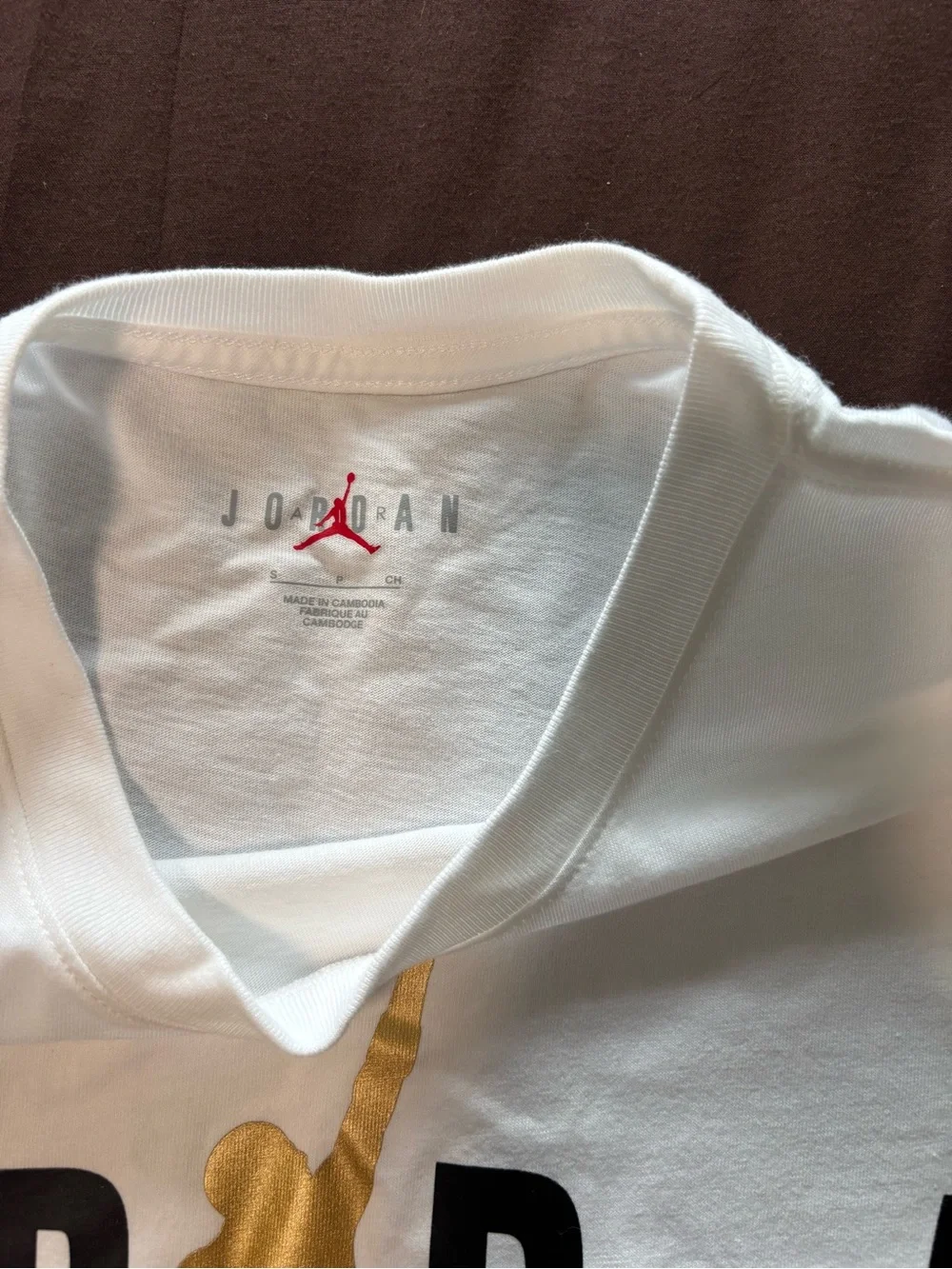 Jordan White Short-Sleeve Tee with Gold Jumpman and Black Lettering